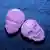Pílulas de ecstasy cor de rosa e com imagem de uma caveira gravada
