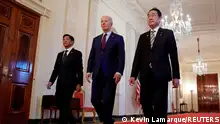 U.S. President Joe Biden escorts Philippines President Ferdinand Marcos Jr. and Japan Prime Minister Fumio Kishida to their trilateral summit at the White House in Washington, U.S., April 11, 2024. REUTERS/Kevin Lamarque TPX IMAGES OF THE DAY 