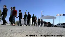 FILE - Migrants from Syria walk towards a refugee camp at Kokkinotrimithia, outside of the capital Nicosia, Sunday, Sept. 10, 2017, in the eastern Mediterranean island of Cyprus. The president of Cyprus Nikos Christodoulides said on Tuesday, April 2, 2024, he has personally asked the head of the European Union's executive arm to intercede with Lebanese authorities so that they could put a stop to boat loads of Syrian refugees from heading to the east Mediterranean island nation. (AP Photo/Petros Karadjias, File)