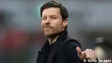 LEVERKUSEN, GERMANY - MARCH 19: Xabi Alonso, Head Coach of Bayer 04 Leverkusen, reacts during the Bundesliga match between Bayer 04 Leverkusen and FC Bayern München at BayArena on March 19, 2023 in Leverkusen, Germany. (Photo by Dean Mouhtaropoulos/Getty Images)