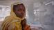 A mother holds her child at a medical treatment camp near the Sudan border A mother holds her child at a medical treatment camp near the Sudan border