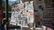 Newspapers are hanging on a kiosk in the center of Athens Newspapers are hanging on a kiosk in the center of Athens