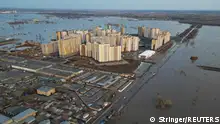 12/04/2024**A drone view shows a flooded area around the Dubki residential complex in Orenburg, Russia, April 12, 2024. REUTERS/Stringer