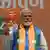 Indian Prime Minister Narendra Modi holding his party's manifesto