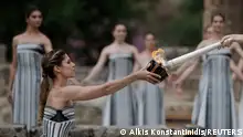 Paris 2024 Olympics - Olympic Flame Lighting Ceremony - Ancient Olympia, Greece - April 16, 2024
Greek actress Mary Mina, playing the role of High Priestess, lights the flame during the Olympic Flame lighting ceremony for the Paris 2024 Olympics. REUTERS/Alkis Konstantinidis