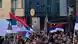 Сербские флаги и портрет осужденного военного преступника Ратко Младича на митинге в Баня-Луке, столице Республике Сербскаой, апрель 2024 года