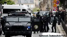 French police and members of French special police forces of Research and Intervention Brigade (BRI) secure the area near Iran consulate where a man is threatening to blow himself up, in Paris, France, April 19, 2024. REUTERS/Benoit Tessier 