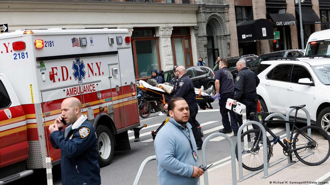 An ambulance awaits outside a New York courthouse where a man set himself of fire on April 19, 2024