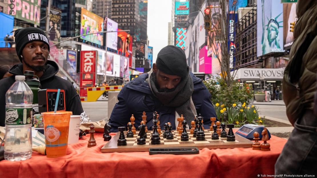 Tunde Onakoya pictured playing a game of chess during his record attempt