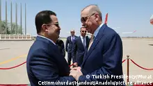 BAGHDAD, IRAQ - APRIL 22: ----EDITORIAL USE ONLY - MANDATORY CREDIT - 'TURKISH PRESIDENCY / MURAT CETINMUHURDAR / HANDOUT' - NO MARKETING NO ADVERTISING CAMPAIGNS - DISTRIBUTED AS A SERVICE TO CLIENTS----) Turkish President Recep Tayyip Erdogan is welcomed by Iraqi Prime Minister Mohammed Shia al-Sudani with an official ceremony upon his arrival at Baghdad International Airport in Baghdad, Iraq on April 22, 2024. Turkish Presidency/Murat Cetinmuhurdar/Handout / Anadolu