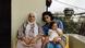 Film still from 'Bye Bye Tiberias': Three generations of women, grandmother, mother and baby, pose for a photo on a balcony. Film still from 'Bye Bye Tiberias': Three generations of women, grandmother, mother and baby, pose for a photo on a balcony.