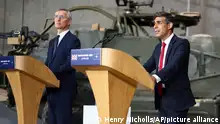 NATO Secretary General Jens Stoltenberg, left, and Britain's Prime Minister Rishi Sunak address a press conference at the Warsaw Armoured Brigade in Warsaw, Poland, on Tuesday April 23, 2024. (Henry Nicholls, Pool Photo via AP)