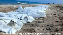 Covered bodies of victims are seen from a capsized boat near the coastal town of Obock, in northeastern Djibouti Tuesday, April 9, 2024. The United Nations migration agency says 38 migrants are dead and 22 others have been rescued from a shipwreck off Djibouti on a popular route to Yemen. (International Organization for Migration via AP)