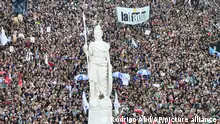 Demonstrators gather outside the Casa Rosada presidential palace during a march demanding more funding for public universities and to protest against austerity measures proposed by President Javier Milei, in Buenos Aires, Argentina, Tuesday, April 23, 2024. (AP Photo/Rodrigo Abd)