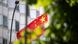 The Chinese flag that flies in front of its embassy in Berlin is half hidden by trees The Chinese flag that flies in front of its embassy in Berlin is half hidden by trees