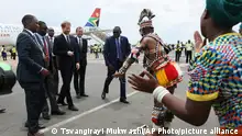 Zambian traditional dancers perform for Britain's Prince Harry, centre left, upon his arrival at Kenneth Kaunda airport in Lusaka, Monday, Nov. 26, 2018. Prince Harry is on a State visit to Zambia at the request of the Commonwealth office and is expected to attend various events in the Southern African country.(AP Photo/Tsvangirayi Mukwazhi)