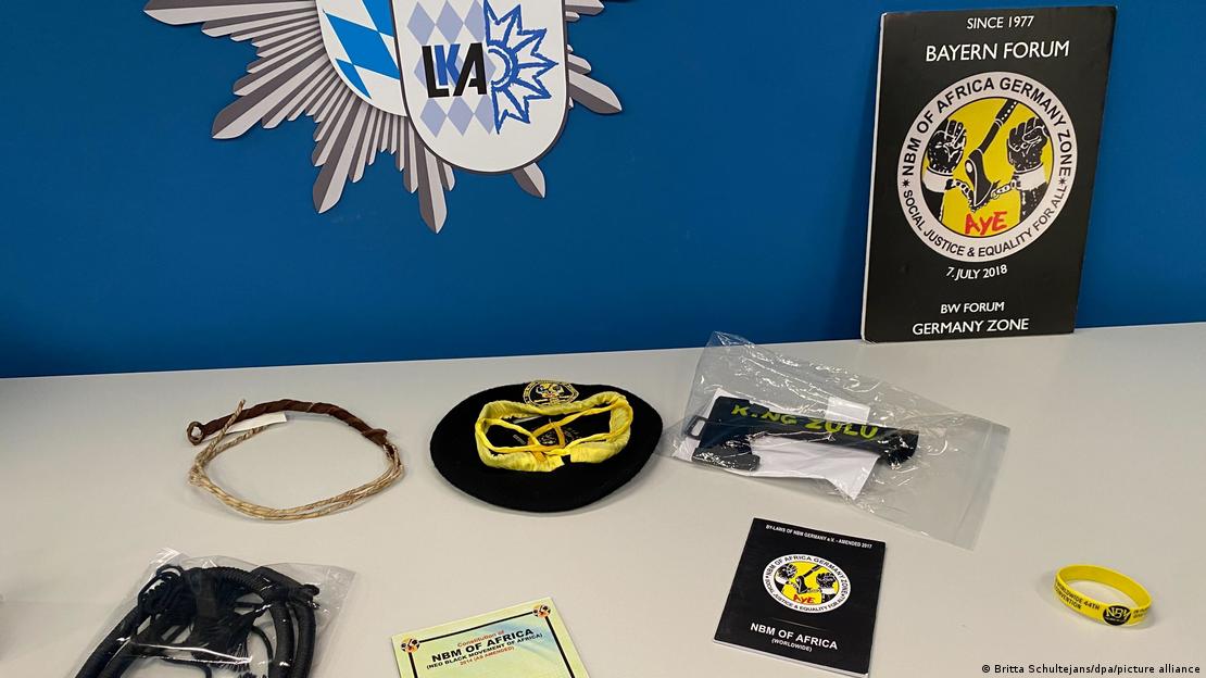 A desk displaying various black-and-yellow paraphernalia, the signature colors of the crime group Black Axe A desk displaying various black-and-yellow paraphernalia, the signature colors of the crime group Black Axe