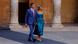 Spanish Prime Minister Pedro Sánchez and his wife Begona Gomez walking through a courtyard Spanish Prime Minister Pedro Sánchez and his wife Begona Gomez walking through a courtyard