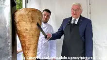 22/04/2024 *** ISTANBUL, TURKIYE - APRIL 22: German President Frank-Walter Steinmeier cuts doner meat at the residence of the German Ambassador in Tarabya in Istanbul, Turkiye on April 22, 2024. Cuneyt Karadag / Anadolu