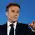 French President Emmanuel Macron gestures during a press conference at the end of the European Council summit at the EU headquarters in Brussels, on April 18, 2024