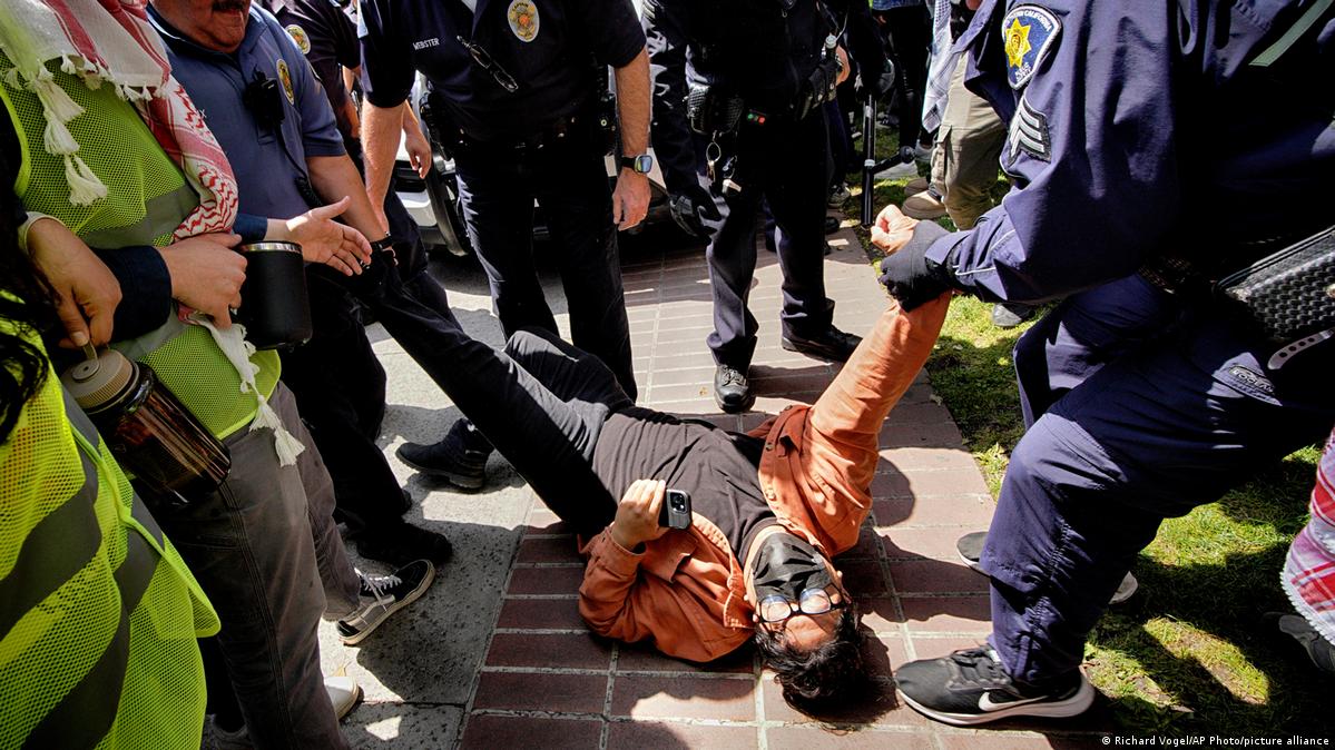 A University of Southern California protester is detained during a pro-Palestinian protest