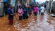 Residents of Nairobi's Mathare neighborhood are seen in a flooded street after heavy rains as they try to evacuate the area with their belongings Residents of Nairobi's Mathare neighborhood are seen in a flooded street after heavy rains as they try to evacuate the area with their belongings