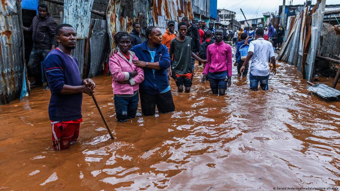 Residents in a flooded street of Mathare neighborhood in Nairobi