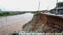 DAR ES SALAAM, April 24, 2024 (Xinhua) -- Photo taken on April 24, 2024 shows a landslide on a river shore due to flash floods caused by ongoing heavy rains on the outskirts of Dar es Salaam, Tanzania. At least 66 were killed from flash floods in Tanzania, caused by heavy rains. (Xinhua/Emmanuel Herman)