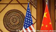 26/04/2024 *** Flags of the U.S and China sit in a room where U.S. Secretary of State Antony Blinken meets with China's Minister of Public Security Wang Xiaohong at the Diaoyutai State Guesthouse, Friday, April 26, 2024, in Beijing, China. (AP Photo/Mark Schiefelbein, Pool)