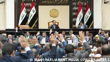 FILE PHOTO: Iraqi lawmakers attend a parliamentary session to vote on the federal budget, in Baghdad, Iraq, June 11, 2023. Iraqi Parliament Media Office/Handout via REUTERS ATTENTION EDITORS - THIS IMAGE HAS BEEN SUPPLIED BY A THIRD PARTY/File Photo