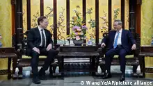 In this photo released by Xinhua News Agency, visiting Tesla founder and CEO Elon Musk, left, meets with Chinese Premier Li Qiang in Beijing, Sunday, April 28, 2024. Musk met with a top government leader in the Chinese capital Sunday, just as the nation's carmakers are showing off their latest electric vehicle models at the Beijing auto show. (Wang Ye/Xinhua via AP)