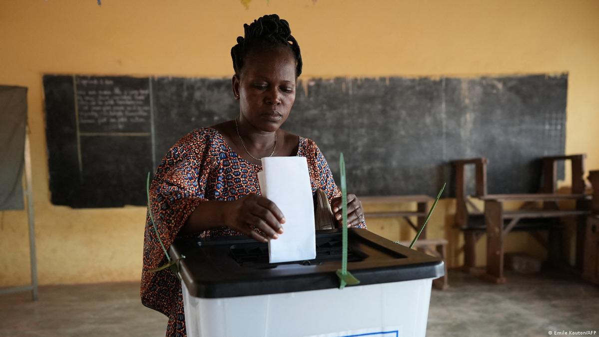 A voter casts her ballot at a polling station at the Hedzranawoe public primary school in Lome on April 29, 2024, during Togo's legislative elections.