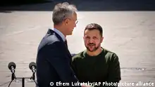 Ukrainian President Volodymyr Zelenskyy, right, welcomes NATO Secretary General Jens Stoltenberg during their meeting in Kyiv, Ukraine, Monday, April 29, 2024. (AP Photo/Efrem Lukatsky)