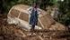 A girl stands on a pile of debris next to a damaged car buried in mud in an area heavily affected by torrential rains and flash floods in Kenya in 2024 A girl stands on a pile of debris next to a damaged car buried in mud in an area heavily affected by torrential rains and flash floods in Kenya in 2024