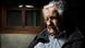 Primer plano de Mujica sentado en su casa a la luz de una lámpara que forma claroscuros. Primer plano de Mujica sentado en su casa a la luz de una lámpara que forma claroscuros.