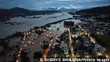 An aerial view shows flooded areas in Encantado city, Rio Grande do Sul, Brazil, on May 1, 2024. At least 10 people have died in floods caused by torrential rains in Brazil's south, authorities said on May 1, as rescuers searched for nearly two dozen individuals reported missing. (Photo by Gustavo Ghisleni / AFP) (Photo by GUSTAVO GHISLENI/AFP via Getty Images)