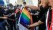 Supporters of the Popular Mobilization Forces burn a rainbow flag during a protest in Tahrir Square in Baghdad. Supporters of the Popular Mobilization Forces burn a rainbow flag during a protest in Tahrir Square in Baghdad.