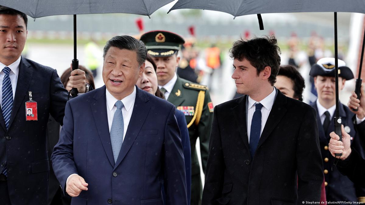 France's Prime Minister Gabriel Attal greets China's President Xi Jinping upon their arrival for an official two-day state visit, at Orly airport