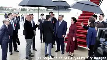 05/05/2024 *** France's Prime Minister Gabriel Attal (C-L) greets China's President Xi Jinping (C-R) and his wife Peng Liyuan upon their arrival for an official two-day state visit, at Orly airport, south of Paris on May 5, 2024. Chinese President Xi Jinping arrived in France on May 5, 2024, for a state visit hosted by Emmanuel Macron where the French leader will seek to push his counterpart on issues ranging from Ukraine to trade. (Photo by STEPHANE DE SAKUTIN / POOL / AFP) (Photo by STEPHANE DE SAKUTIN/POOL/AFP via Getty Images)