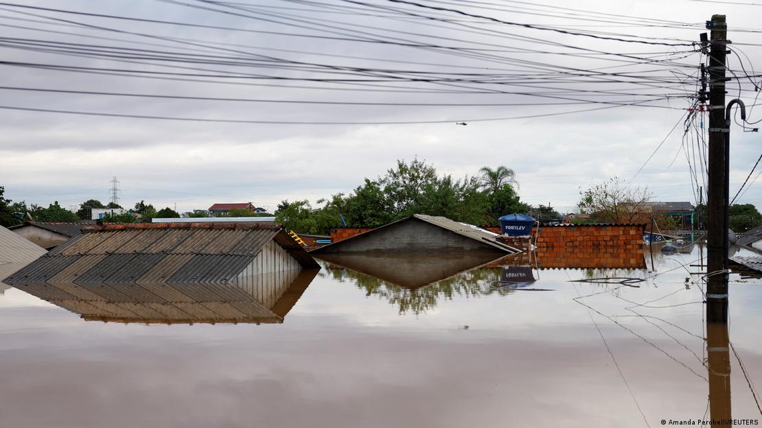 The peaks of roofs stick out of floodwaters in Canoas, Rio Grande do Sul, Brazil