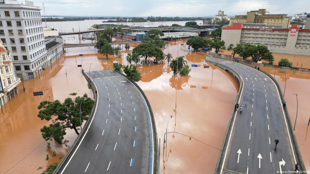 A bird's eye view of flooding in the center of Porto Alegre showing freeway bridges submerged by muddy waters