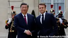 06.05.2024+++ French President Emmanuel Macron shakes hands with President Xi Jinping as he arrives for a meeting at the Elysee Palace in Paris as part of the Chinese president's two-day state visit in France, May 6, 2024. REUTERS/Gonzalo Fuentes 