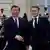  Xi e Macron se cumprimentando