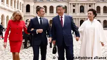 Chinese President Xi Jinping and his wife Peng Liyuan, French President Emmanuel Macron and his wife Brigitte Macron leave the official welcoming ceremony at the Hotel national des Invalides monument in Paris, Monday, May 6, 2024. China's President Xi Jinping is in France for a two-day state visit that is expected to focus both on trade disputes and diplomatic efforts to convince Beijing to use its influence to move Russia toward ending the war in Ukraine.(Yoan Valat, Pool via AP)