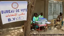 Electoral workers sit beside a ballot box at a polling station during the presidential election in N’djamena, Chad May 6, 2024. REUTERS/Desire Danga Essigue
