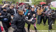 BERLIN, GERMANY - MAY 7: Police intervene to evict pro-Palestine activists after the activists attempted to sep up a protest camp at the Free University on May 07, 2024 in Berlin, Germany. Mostly leftist pro-Palestine activists have been protesting at locations across the city for several weeks, including at a camp near the Chancellery and a sit-in at another of the city's universities.(Photo by Axel Schmidt/Getty Images)