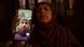 A mother holds a cellphone displaying photos of her son wearing military uniform after being lured to Russia A mother holds a cellphone displaying photos of her son wearing military uniform after being lured to Russia