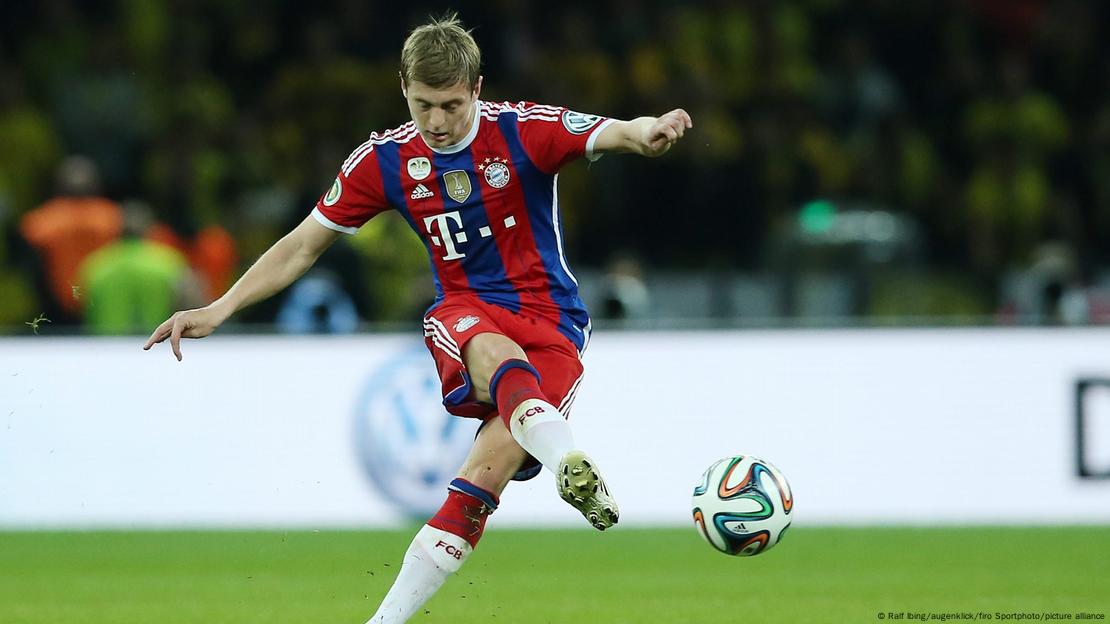 Toni Kroos strikes the ball with his right foot