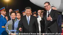 In this photo provided by the Serbian Presidential Press Service, Serbian President Aleksandar Vucic, right, welcomes Chinese President Xi Jinping, center, and his wife Peng Liyuan during a welcome ceremony upon his arrival at the Nikola Tesla airport in Belgrade, Serbia, Tuesday, May 7, 2024. (Serbian Presidential Press Service via AP)