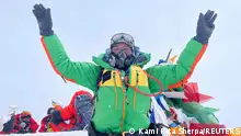 Kami Rita Sherpa, 53, a Nepali Mountaineer who climbed Mount Everest for a record 28 times, is pictured on the summit of Mount Everest during his 28th summit in Everest, May 23, 2023. Kami Rita Sherpa/Handout via REUTERS ATTENTION EDITORS - THIS IMAGE WAS PROVIDED BY A THIRD PARTY.